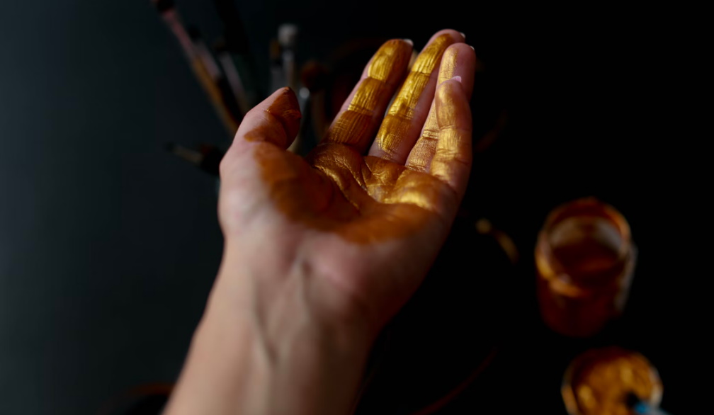 Gold smeared on a hand Gold smeared on a hand